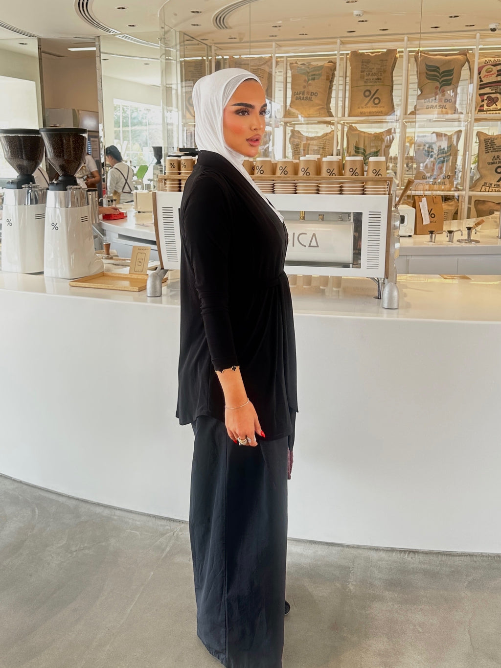 Black cardigan with front belt.