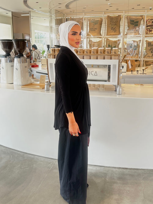 Black cardigan with front belt.