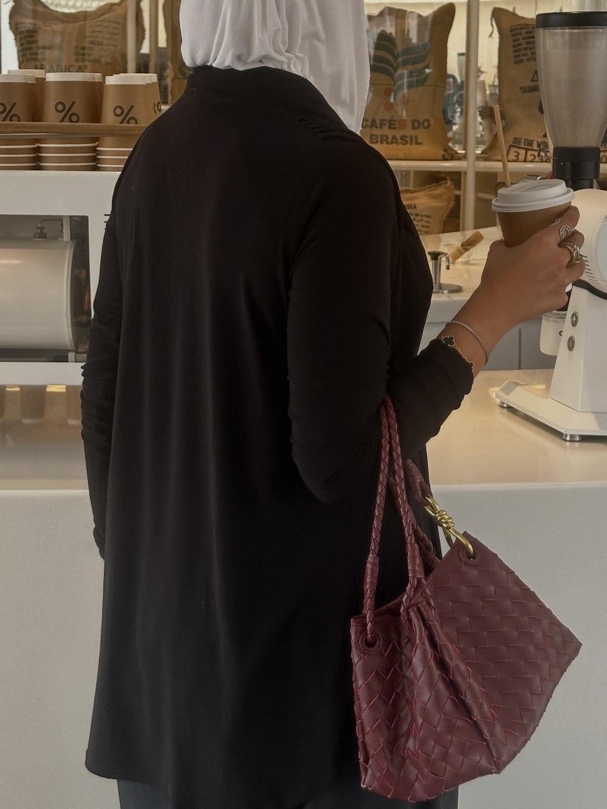 Black cardigan with front belt.